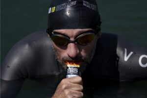 Tim Don taking energy gel in water